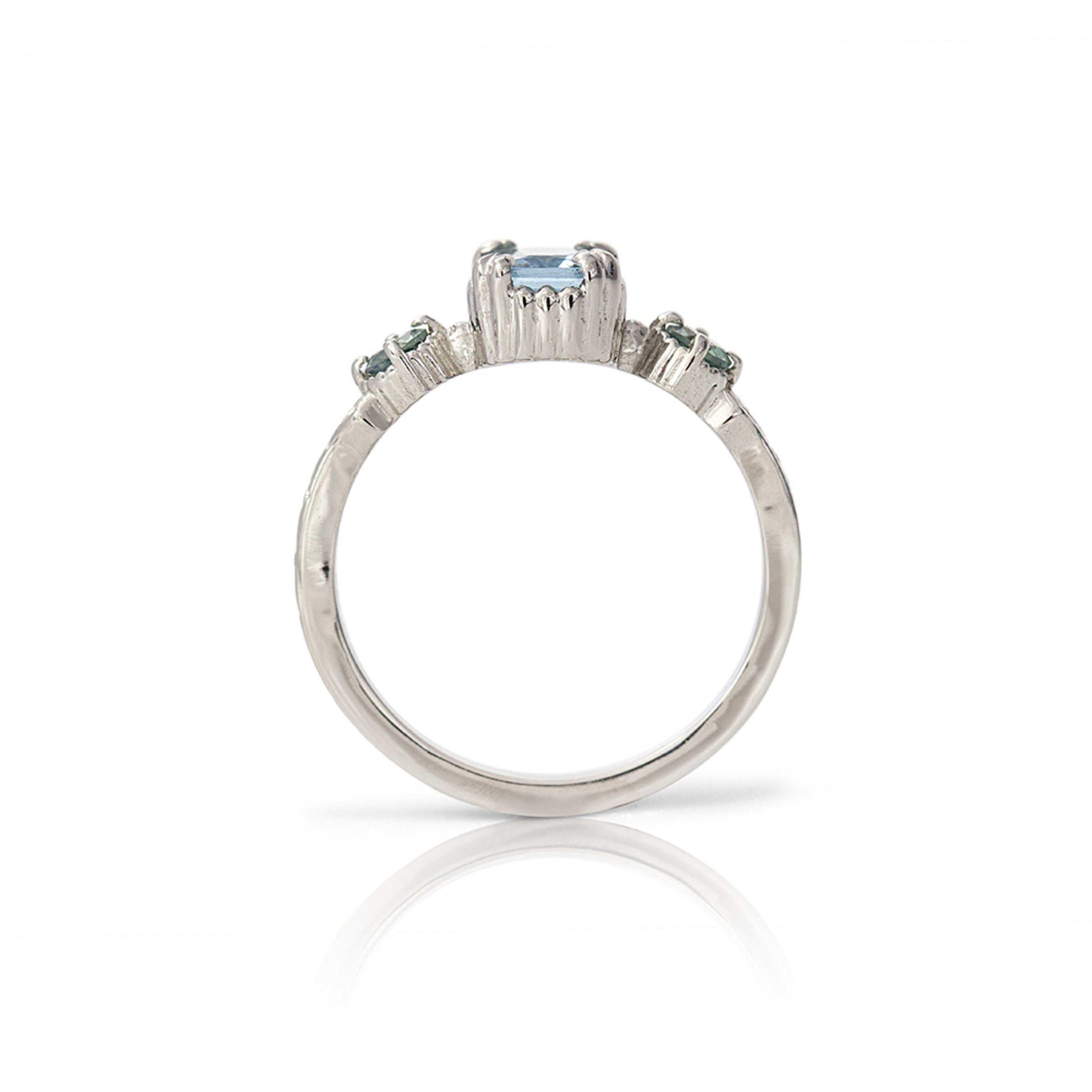 14kt gold vintage-style ring with emerald-cut aquamarine centre and two round alexandrite gemstones, featuring hand-engraved details.