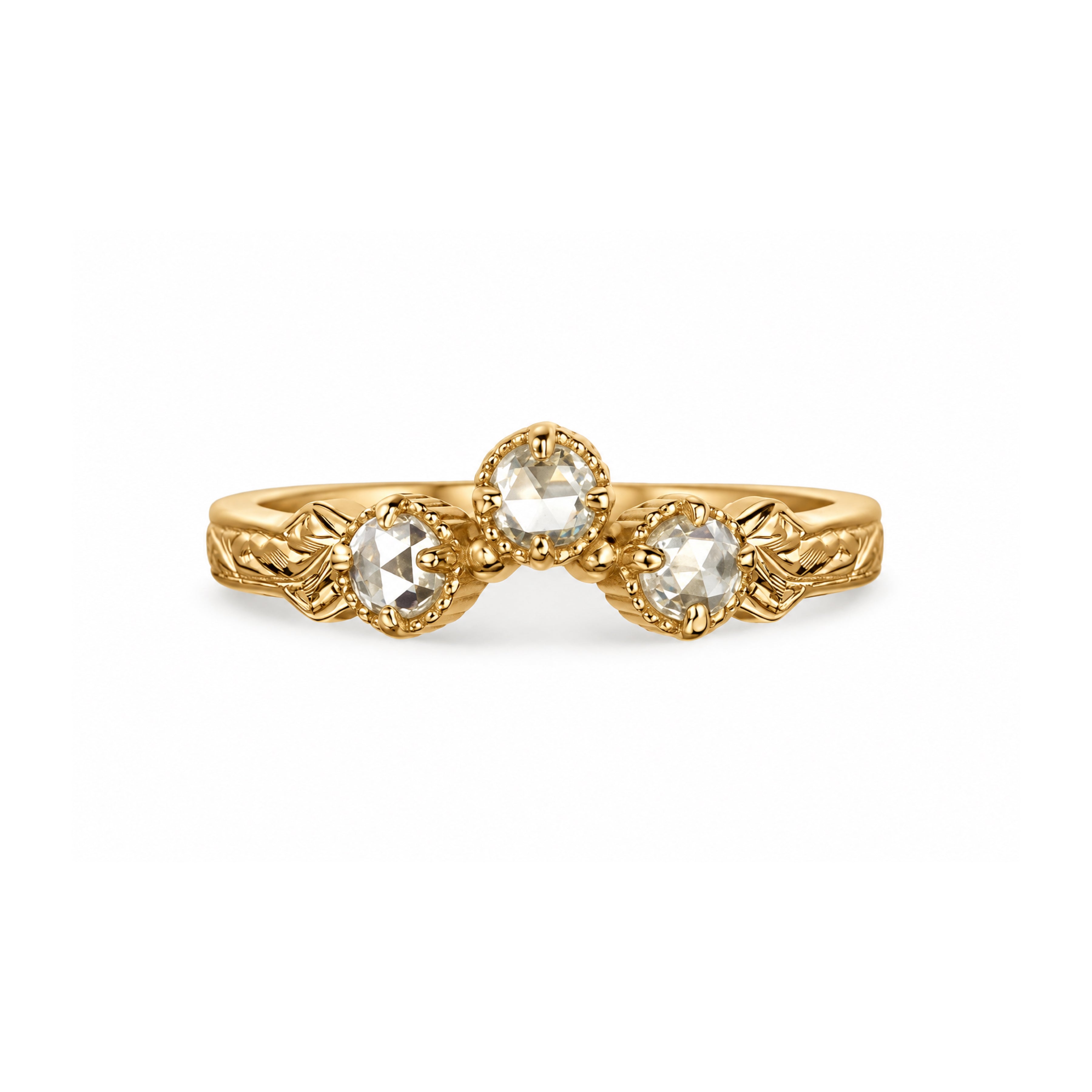 Crafted in 14KT yellow gold, this ring has a curve featuring 3 rose-cut diamonds in a row on a vintage-inspired hand engraved band.