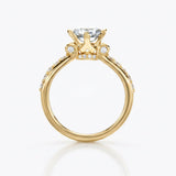 Crafted in 14KT gold, this engagement ring features a princess-cut centre diamond on a diamond-set band. 