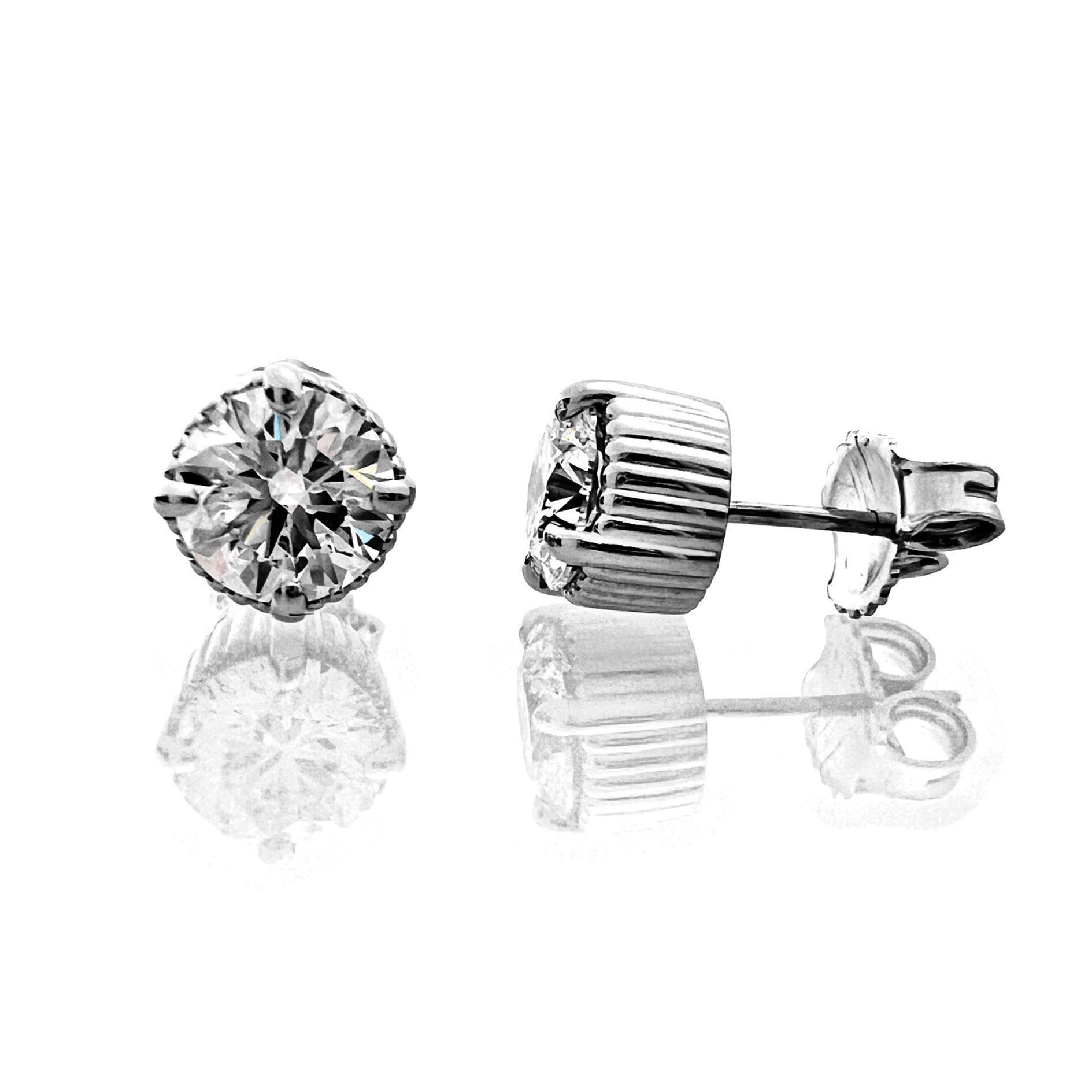 Pair of lab-grown diamond stud earrings on a white background