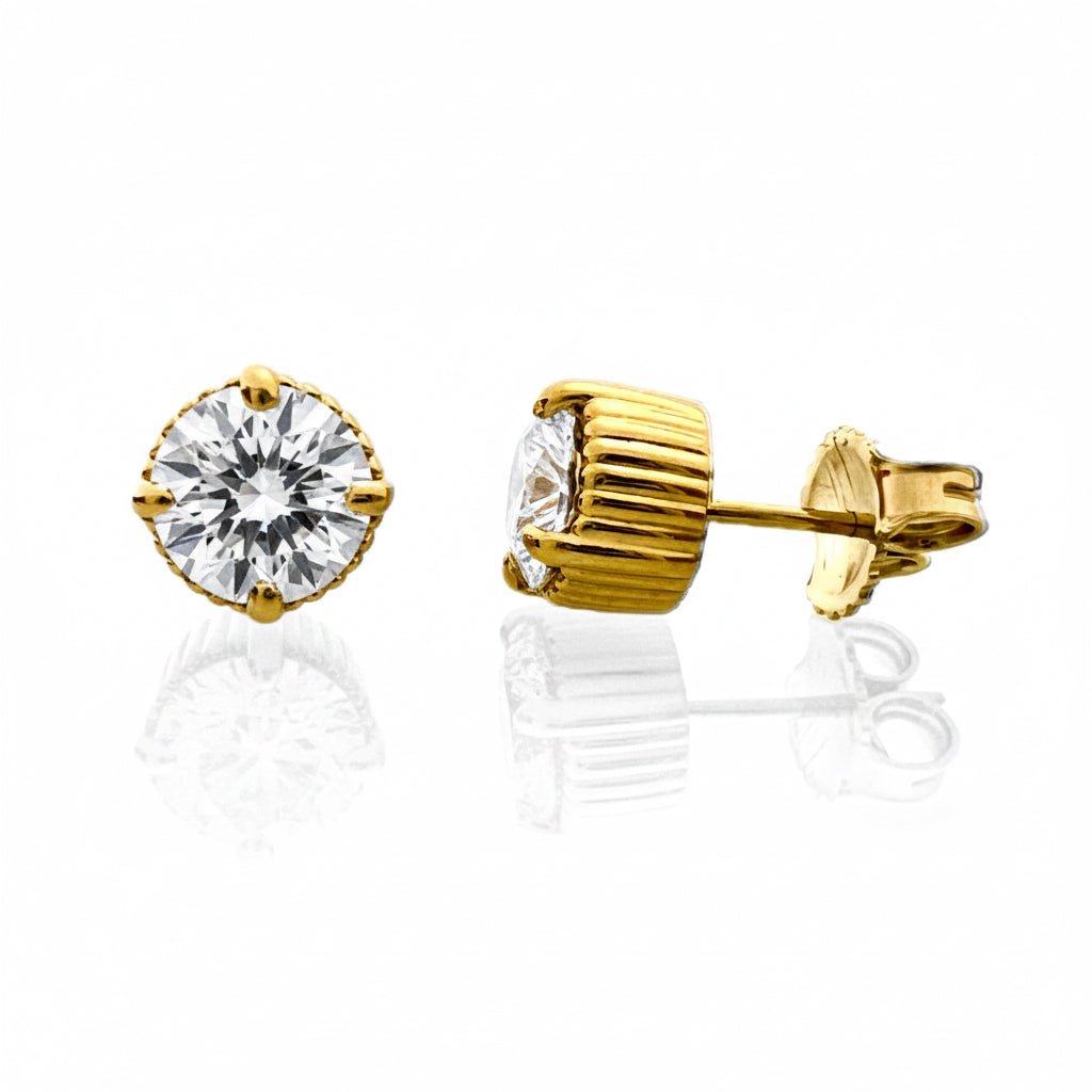 Gold stud earrings with lab-grown diamond on a white background