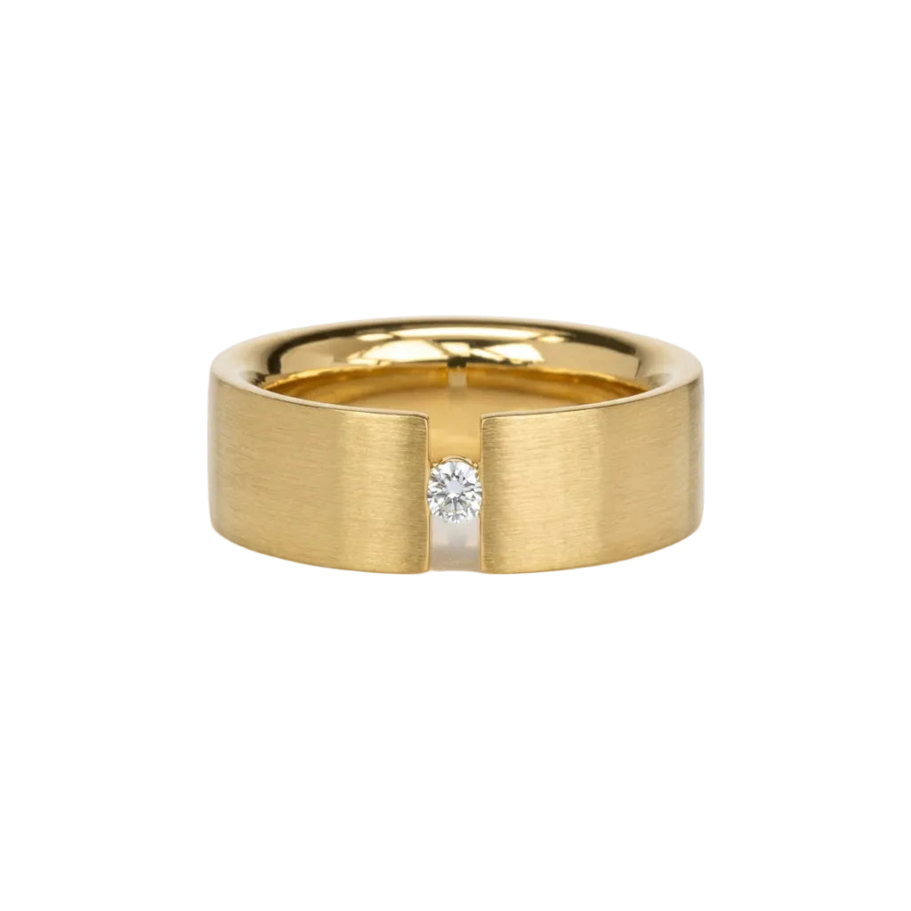 wide 14 karat gold band with a channel set 5pt dianond