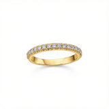 Crafted in 18kt, this band is set round brilliant-cut Canadian diamonds. 