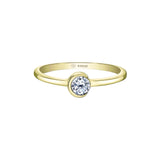 A gold crescent moon ring with a single diamond centerpiece, set on a white background.