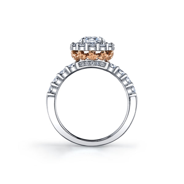 Crafted in 18KT rose and white Certified Canadian Gold, this ring features a diamond set band and halo with a round brilliant-cut Canadian centre diamond and hidden maple leaf details.