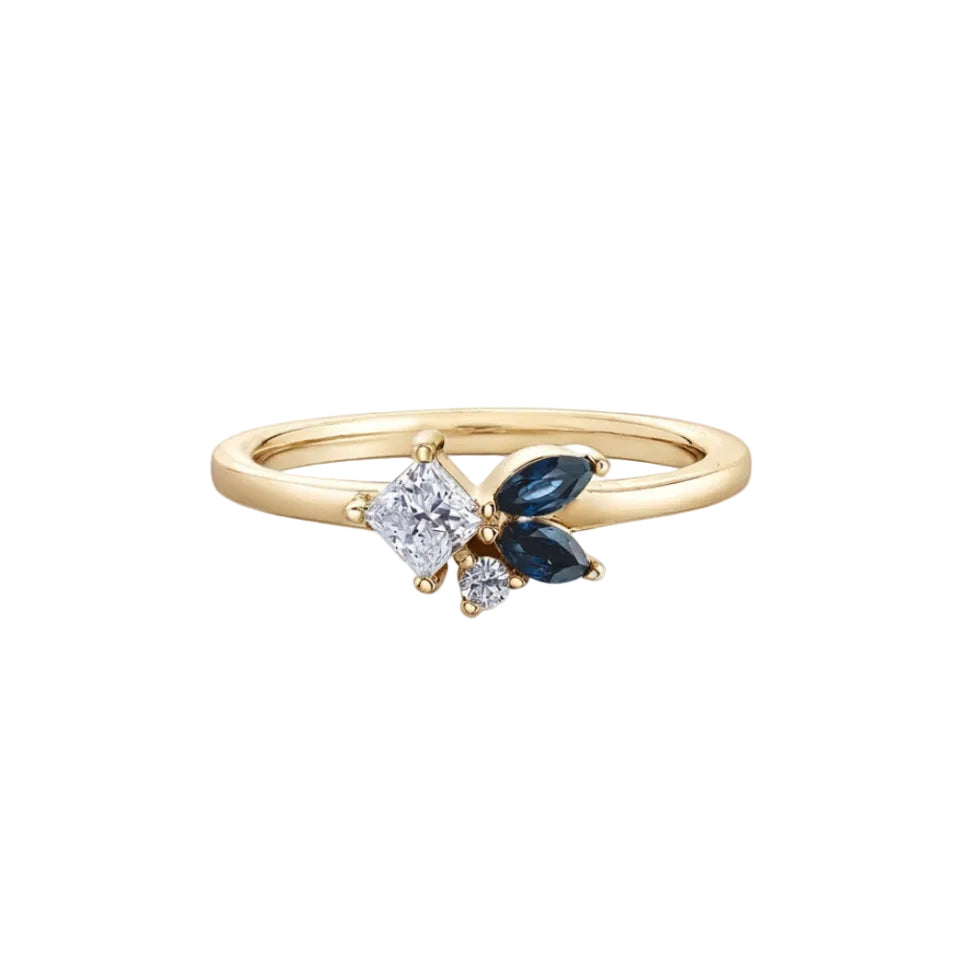 Crafted in 14KT Canadian Certified Gold, this diamond ring is  set with two petal-shaped sapphires and princess cut & round brilliant cut Canadian diamonds.