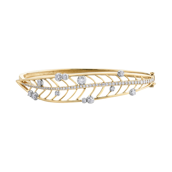 Crafted in 14KT yellow Certified Canadian Gold, this bangle bracelet features a large willow tree leaf set with round brilliant-cut Canadian diamonds.