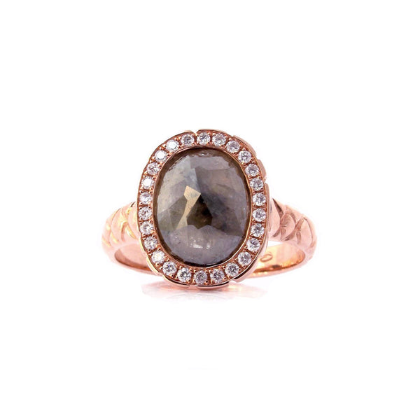 Crafted in 14KT rose gold, this ring features a diamond halo with an oval rose-cut diamond centre and a quilted band. 