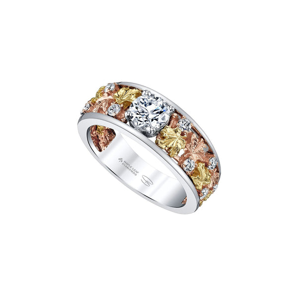 Crafted in 14KT rose, white and yellow Certified Canadian Gold, this ring features maple leafs set small round brilliant-cut Canadian diamonds and a large round brilliant-cut Canadian centre diamond. 