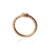 Crafted in 14KT brushed yellow gold, this ring features a bezel-set round brilliant-cut diamond on a semi-quilted band. 
