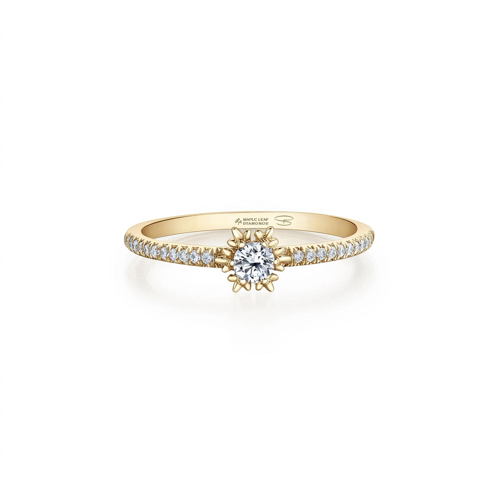 Crafted in 14KT Certified Canadian Gold, this engagement ring features a snowflake set with a round brilliant-cut Canadian diamond on a diamond set band. 