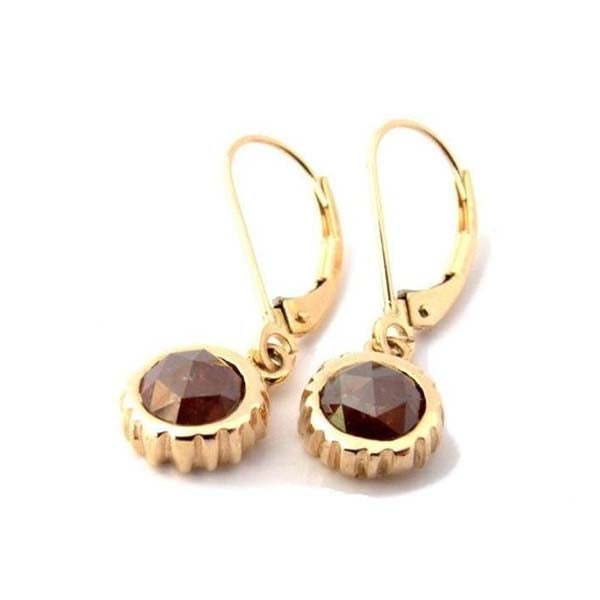 Crafted in 14KT yellow gold, these drop earrings feature oxblood red round rose-cut diamonds in cupcake settings.