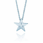 Crafted in 14KT white gold, this star shaped pendant is set with 3 round brilliant-cut diamonds. 