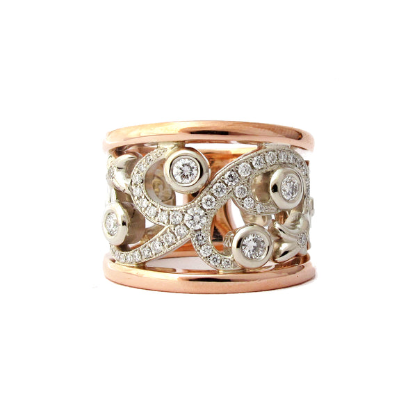 Crafted in 14KT white and rose gold, this ring features a diamond-set vine design with fleur de lys. 
