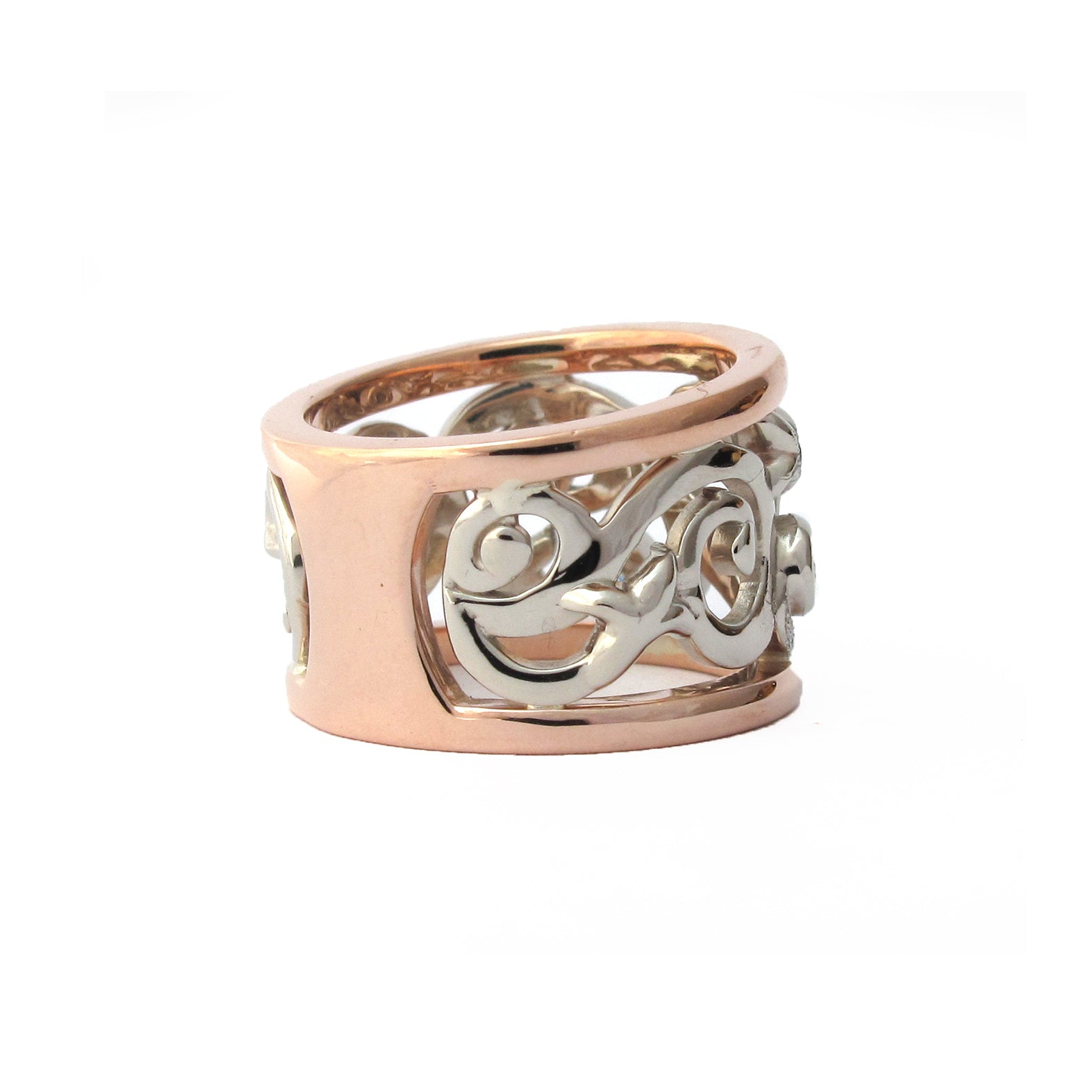 Crafted in 14KT white and rose gold, this ring features a diamond-set vine design with fleur de lys. 