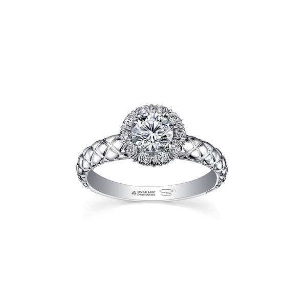 Crafted in 18kt Pure White™, this engagement ring features a melee diamond fur-trim halo with a round brilliant-cut Canadian centre diamond on a quilted band.