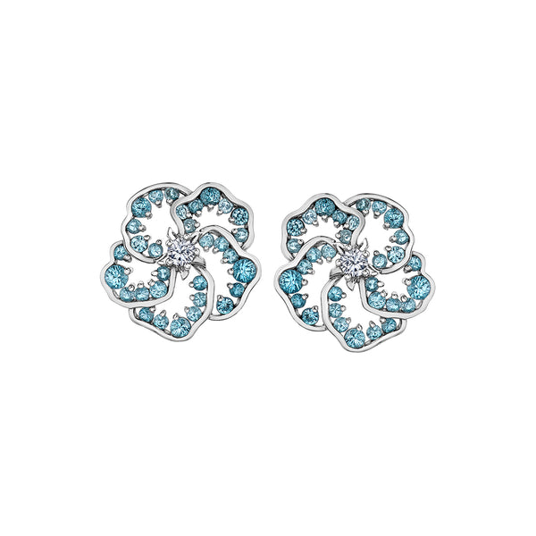 Crafted in 14K white Certified Canadian Gold, these earrings feature a wildflower set with blue topaz and a round brilliant-cut Canadian centre diamond.