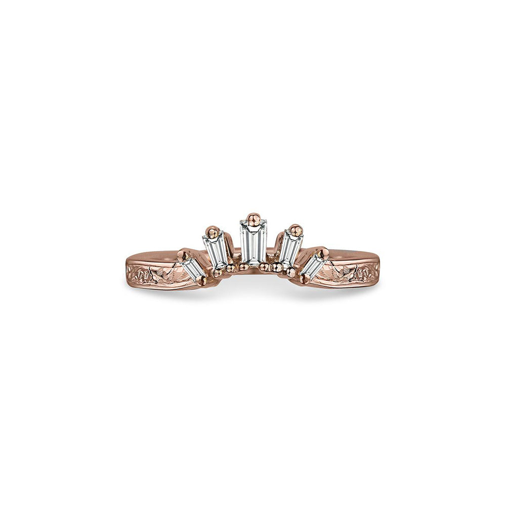 Crafted in 14KT rose gold, this crown inspired ring features 5 tapered baguette diamonds in a row on a vintage-inspired hand engraved band.