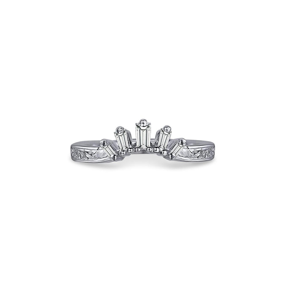 Crafted in 14KT white gold, this crown inspired ring features 5 tapered baguette diamonds in a row on a vintage-inspired hand engraved band.