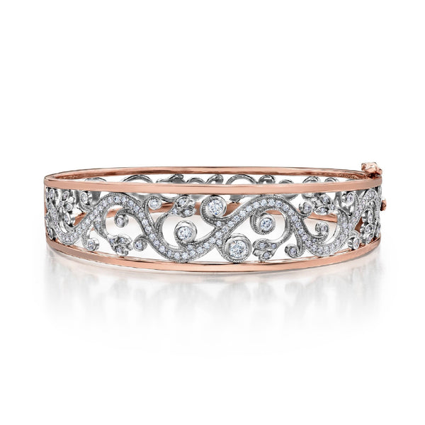 Crafted in 14KT white and rose Certified Canadian Gold, this bangle bracelet features a rose vine design set with round brilliant-cut Canadian diamonds.