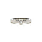 Crafted in 14KT white gold, this ring features a bezel set round brilliant-cut diamond and a flat band.