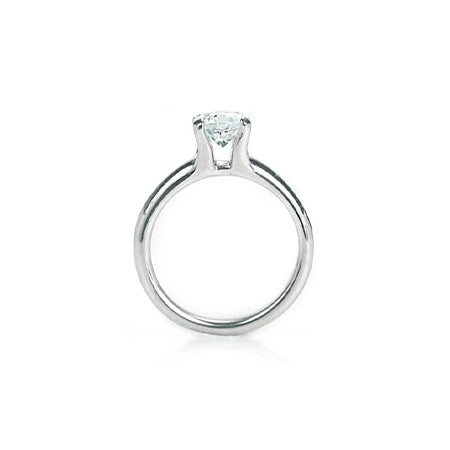 Crafted in 14KT white gold, this ring features a round-cut diamond in the classic four-prong setting. 