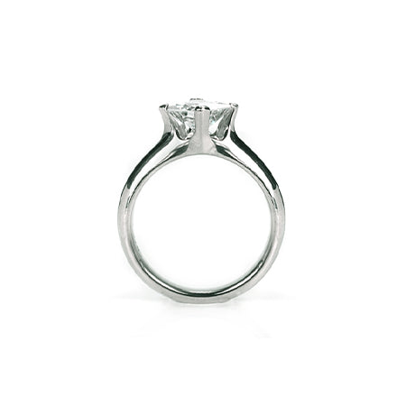 Crafted in 14KT white gold, this ring features a princess-cut diamond in a diagonal prong setting. 