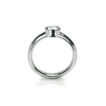 Crafted in 14KT white gold, this ring features a bezel set round brilliant-cut diamond. 