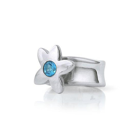 Crafted in sterling silver, this ring features a large flower with a blue topaz centre.