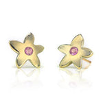 Crafted in 14KT yellow gold, these stud earrings each feature a flower with a pink sapphire centre. 