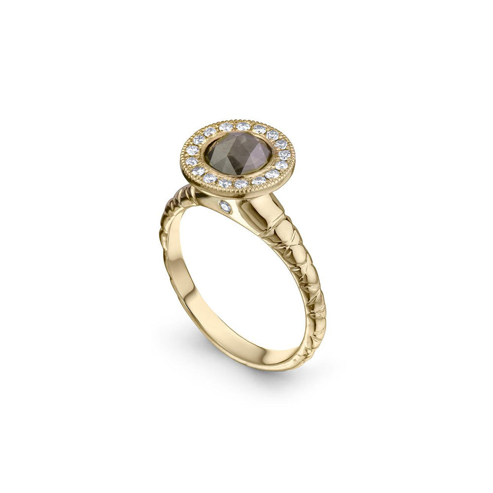 Crafted in 14KT yellow gold, this ring features a diamond halo with a grey rose-cut diamond centre and a quilted band. 