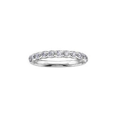 Crafted in 18kt Pure White™, this band is set with round brilliant-cut Canadian diamonds.