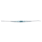 Crafted in 14KT white Certified Canadian Gold, this bracelet features an icicle set with blue topaz and round brilliant-cut Canadian diamonds.