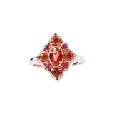 Crafted in 14KT rose and white gold, this ring features round and oval-cut orange and red sapphires set in a diamond shape. 