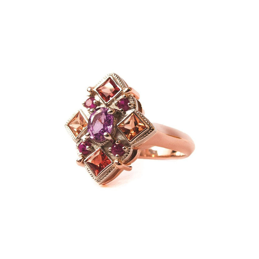 Crafted in 14KT rose and yellow gold, this ring features round, oval and square colourful sapphires set in a diamond shape. 