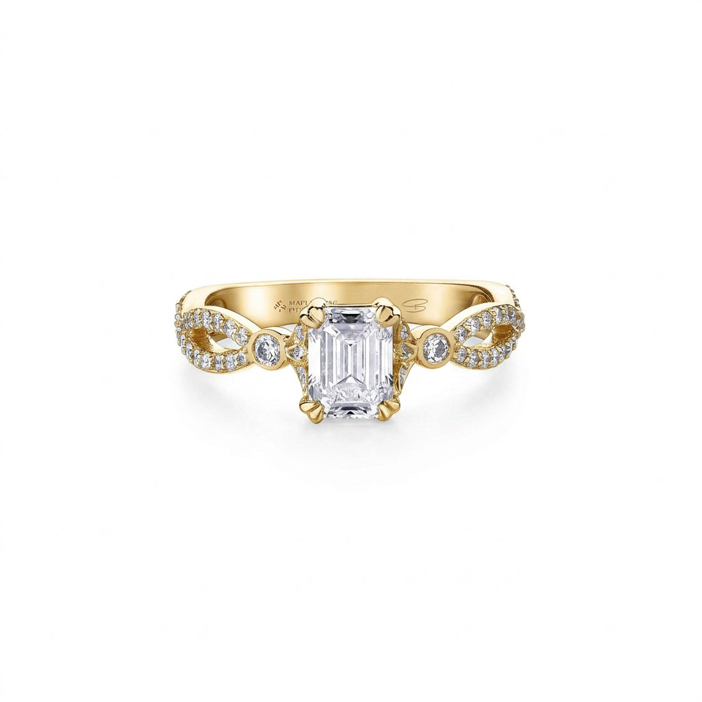 Crafted in 18kt Pure White, this engagement ring features an emerald-cut Canadian centre diamond on a diamond set infinity symbol-inspired band. 
