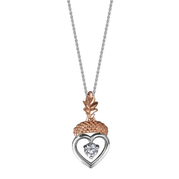 Crafted in 14KT rose and white Canadian Certified Gold, this necklace features a heart-shaped acorn pendant with a round brilliant-cut Canadian centre diamond and an oak leaf bail.