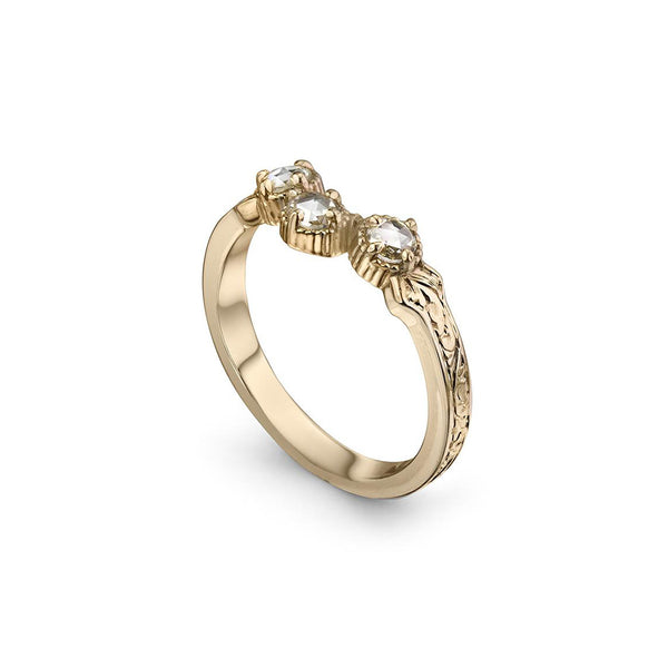 Crafted in 14KT yellow gold, this ring has a curve featuring 3 rose-cut diamonds in a row on a vintage-inspired hand engraved band.