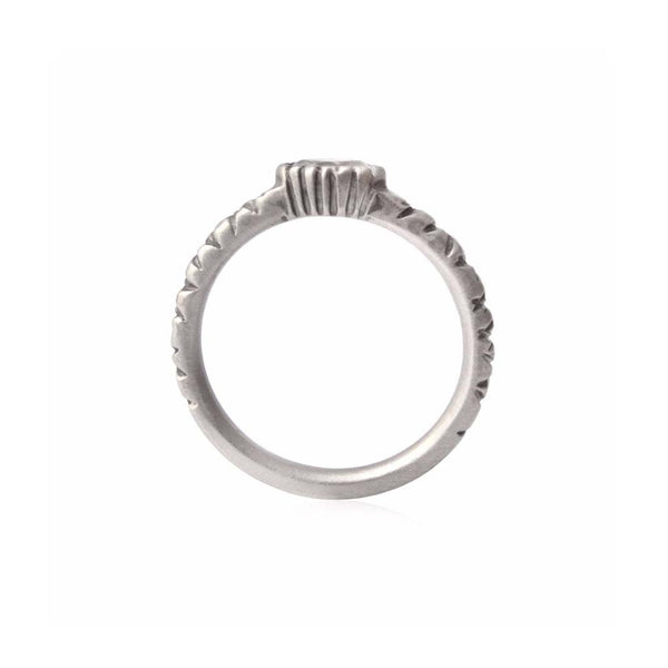 Crafted in 14KT brushed white gold, this ring features a bezel-set marquise-cut diamond on a quilted band. 