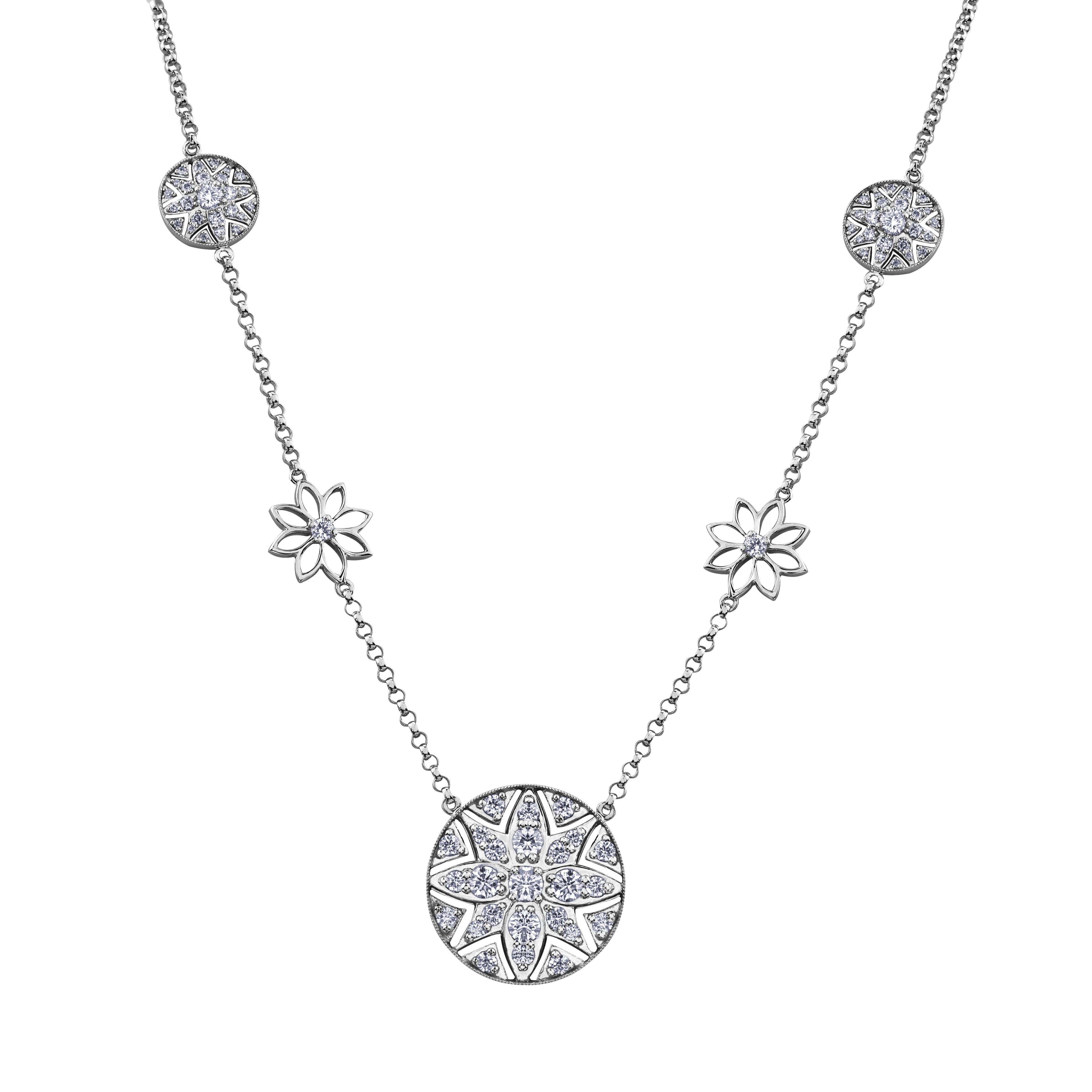 Crafted in 14KT Certified Canadian Gold, this necklace features a filigree water lily pendant set with Canadian diamonds.