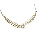 Crafted in 14KT yellow Canadian Certified Gold, this necklace features a round brilliant-cut Canadian diamond between two large diamond-set willow tree leaves.