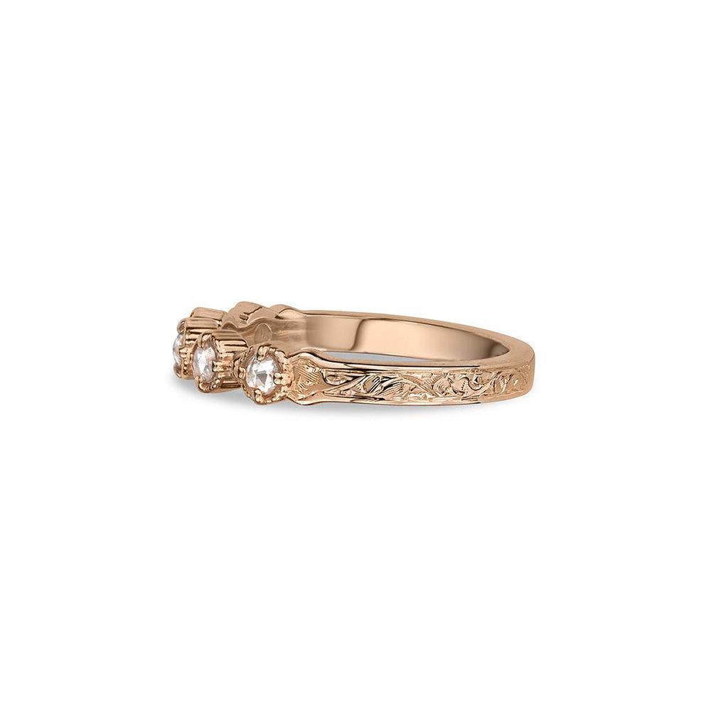 Crafted in 14KT rose gold, this ring features five rose-cut diamonds in cupcake settings on a vintage-inspired hand engraved band. 