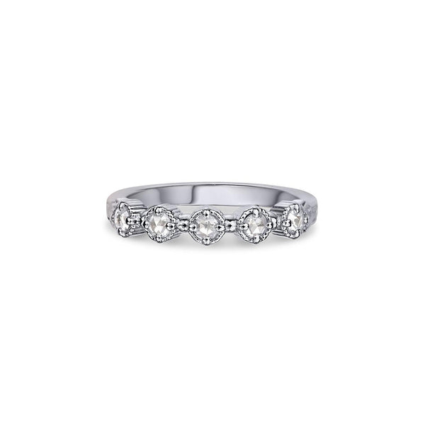 Crafted in 14KT white gold, this ring features five rose-cut diamonds in cupcake settings on a vintage-inspired hand engraved band. 