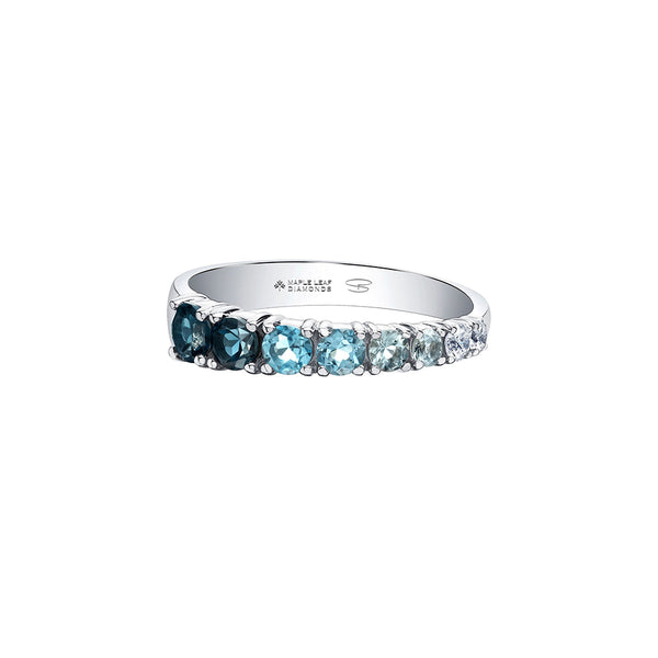 Crafted in 14KT white Certified Canadian Gold, this tapered ring is set with blue topaz and round brilliant-cut Canadian diamonds.
