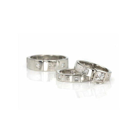 From left to right: ‘Men’s Opulence 6-mm Flat Band with Princess-Cut Diamonds’, ‘Opulence Flat Band with Princess-Cut Diamonds’, ‘Opulence Princess Wide Engagement Ring’.