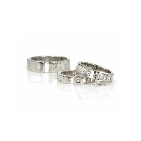From left to right: ‘Men’s Opulence 6-mm Flat Band with Princess-Cut Diamonds’, ‘Opulence Flat Band with Princess-Cut Diamonds’, ‘Opulence Princess Wide Engagement Ring’.