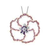 Crafted in 14KT white and rose Certified Canadian Gold, this pendant features a large wildflower set with round brilliant-cut Canadian diamonds, amethyst and pink sapphires.
