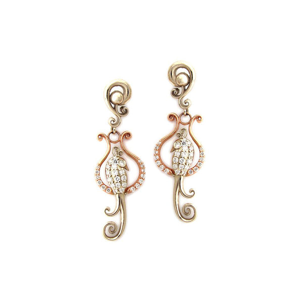 Crafted in 14KT rose and yellow gold, these earrings features birds atop delicate curled perches, both set with round brilliant-cut diamonds.