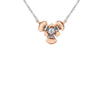 Crafted in 14KT rose and white Certified Canadian Gold, this necklace features a Quebec blue flag iris flower set with a round brilliant-cut Canadian diamond