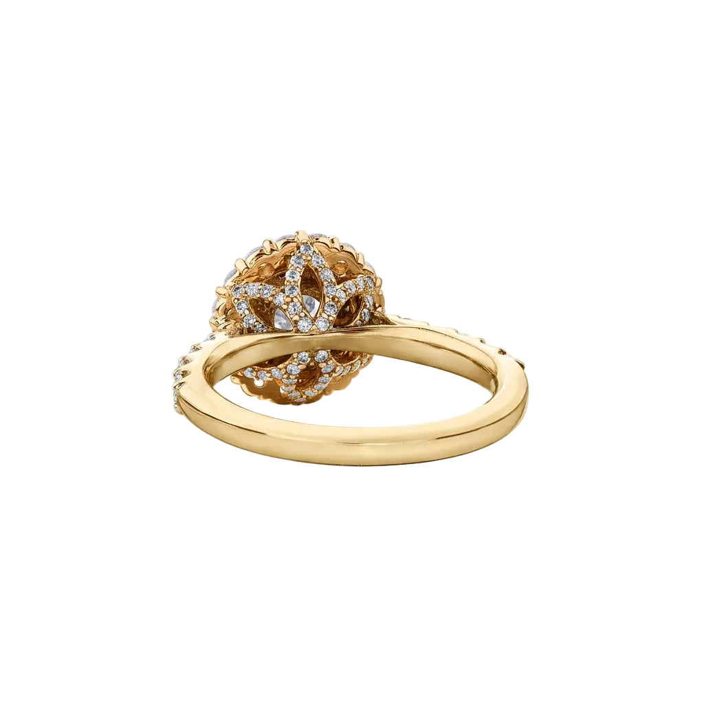 Crafted in 18kt Canadian Certified Gold, this engagement ring features a double halo with a round brilliant-cut Canadian centre diamond on a diamond set band.